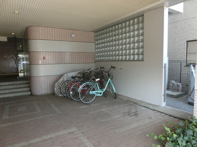 Parking lot. Is a bicycle parking lot on site