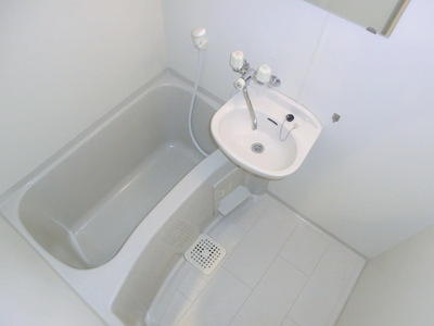 Bath. It is a bathroom with wash basin