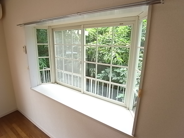 Balcony. Because it is a corner room, It comes with a bay window. 