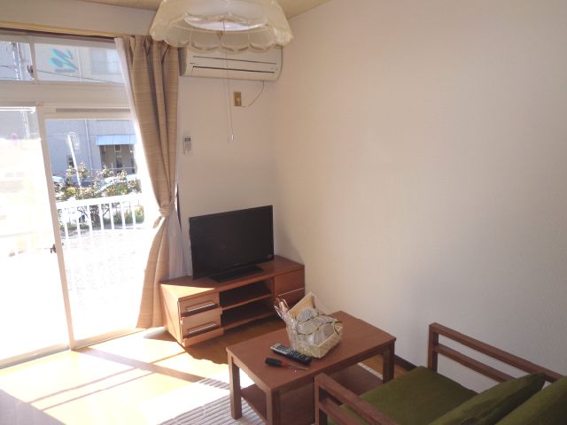 Living and room. It is with furniture appliances.