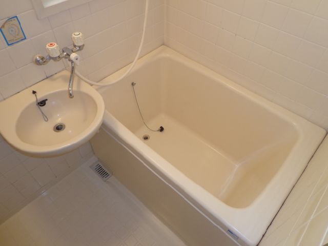 Bath. It is with wash basin.