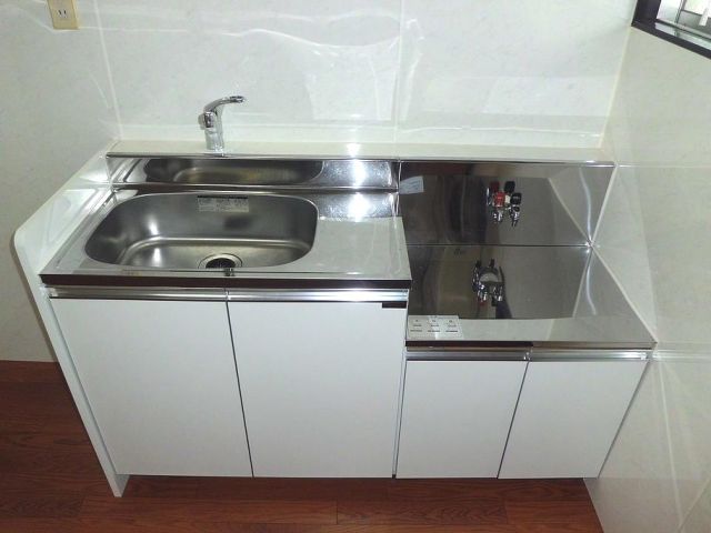 Kitchen. Shiny, Clean kitchen. Two-burner gas stove can be installed. 