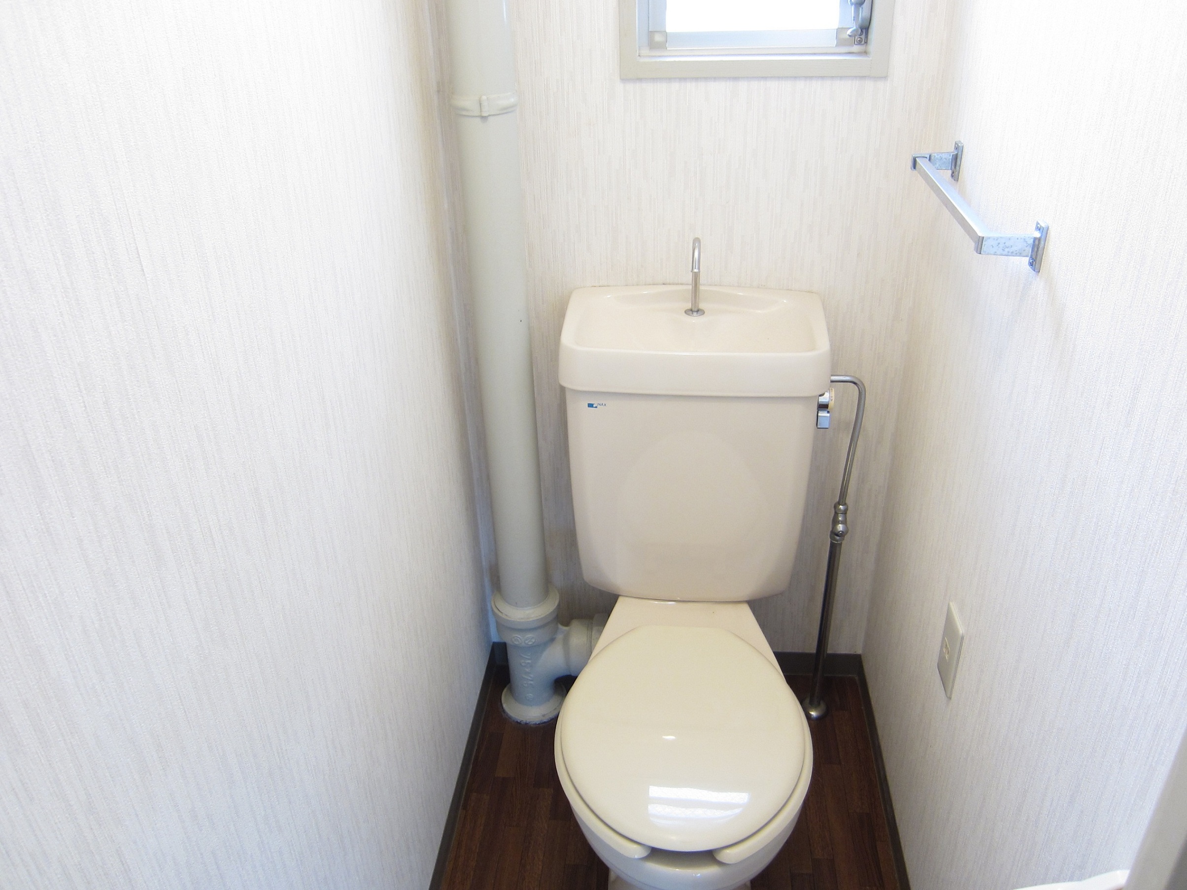 Toilet. Pat ventilation because there is a small window