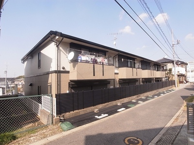 Building appearance. It is a photograph of the south-east-facing balcony side. 