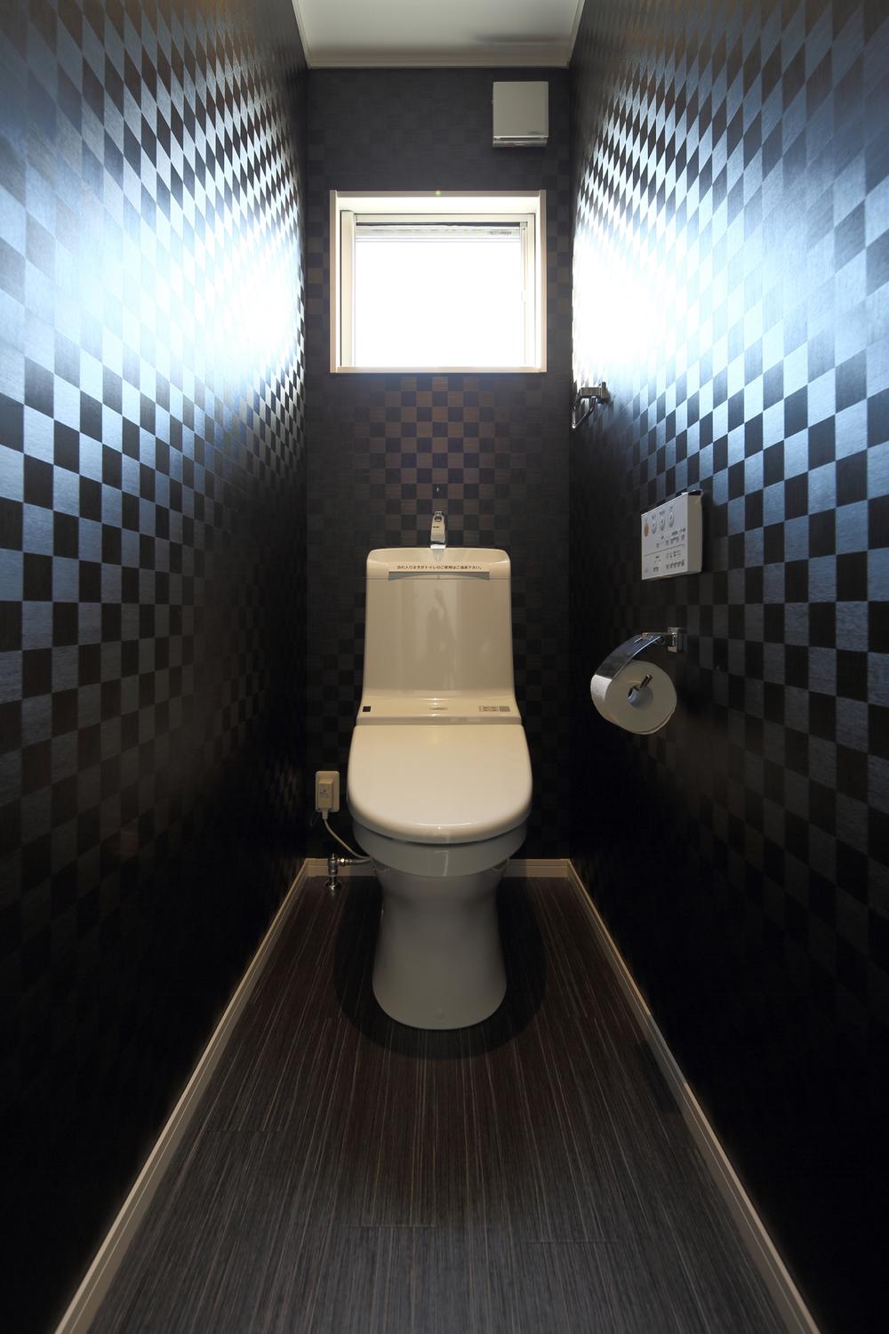 Toilet. This upscale image in black.