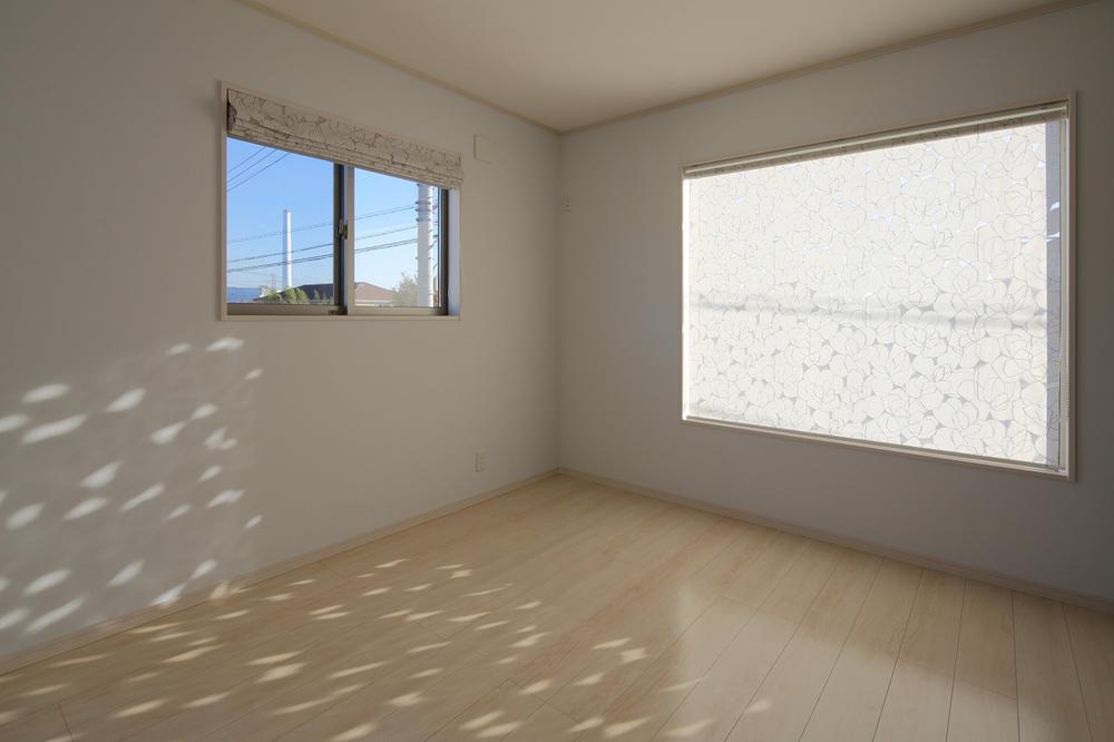 Non-living room. It is a bright space with large windows.