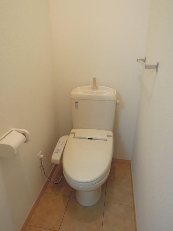 Toilet. It is a toilet with a clean. Bidet equipped. 