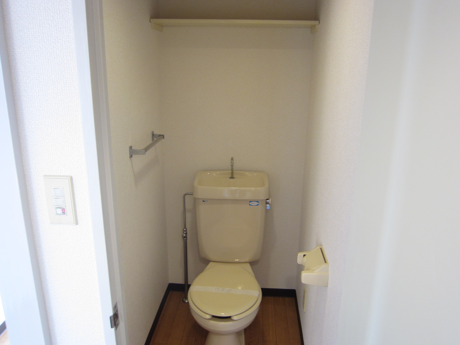 Toilet. It is with a convenient shelf to the toilet!