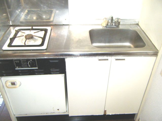 Kitchen. Bite is with a stove.