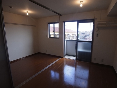 Living and room. Floor is tastefully decorated flooring.