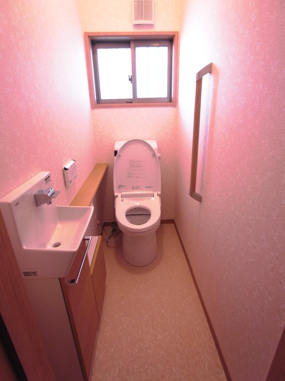 Toilet. Also marked with the toilet on the second floor.