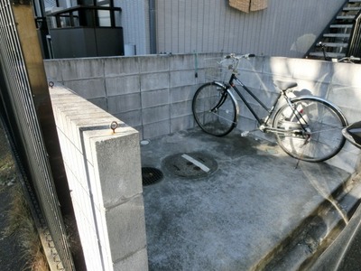 Parking lot. It is a bicycle parking space.