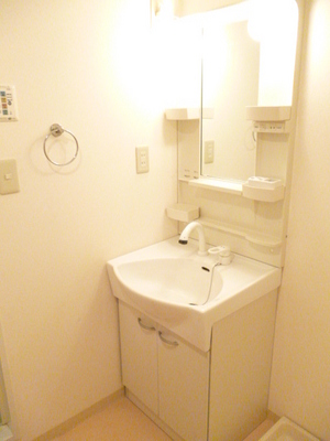 Washroom. Shampoo is a wash basin with a dresser. 