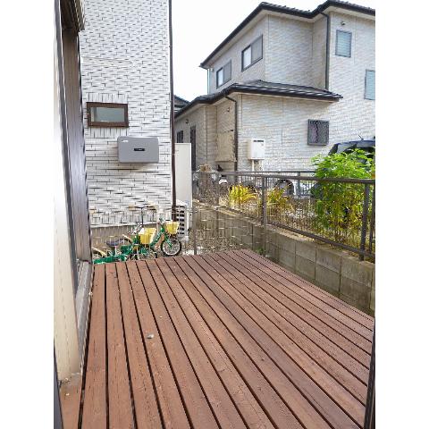 Other. It is a wood deck of southwestward