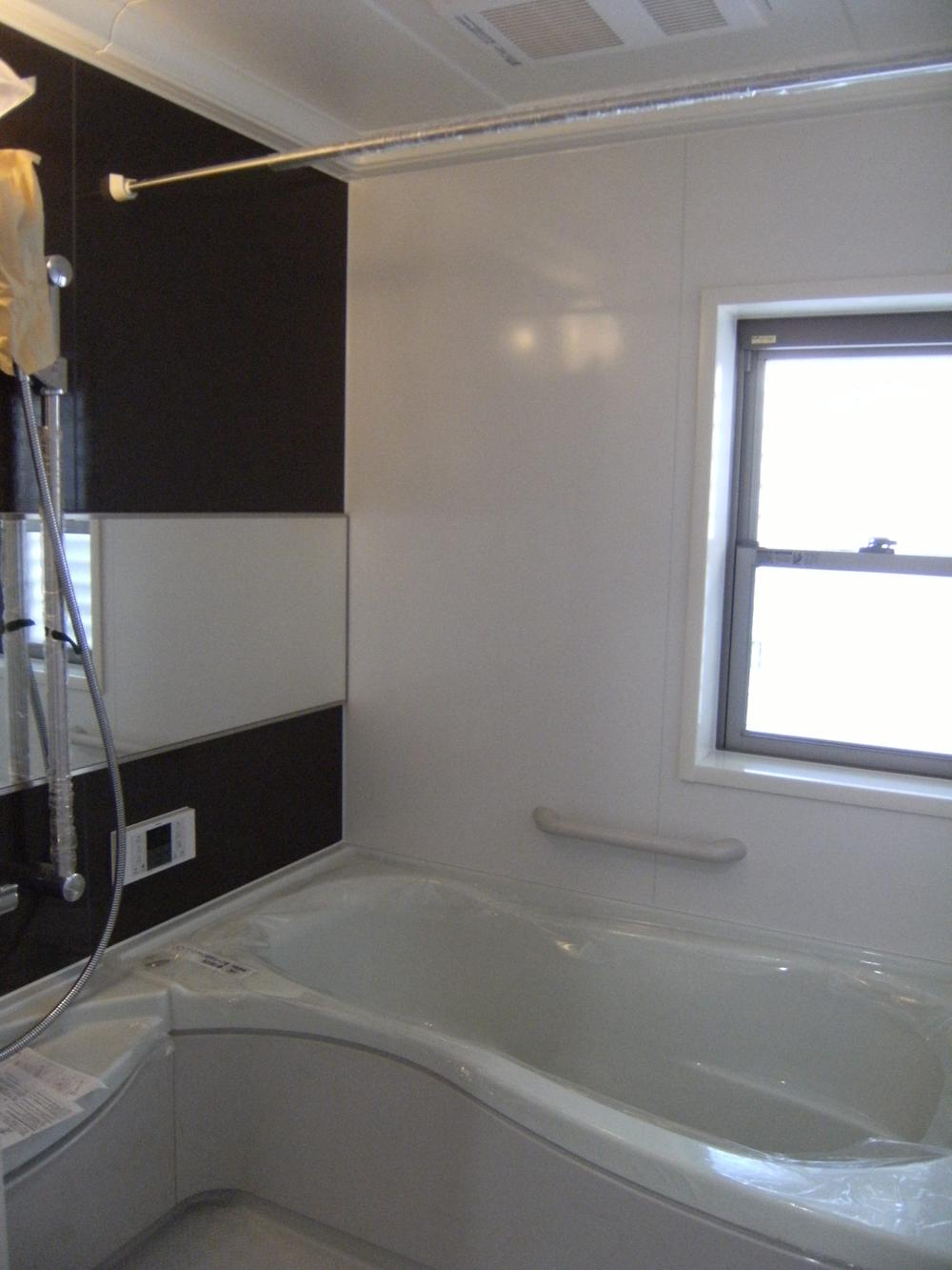 Bathroom. A heated dryer. Artificial marble bathtub.