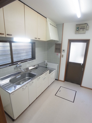 Kitchen. There is a back door, This is useful in household chores, such as garbage disposal.