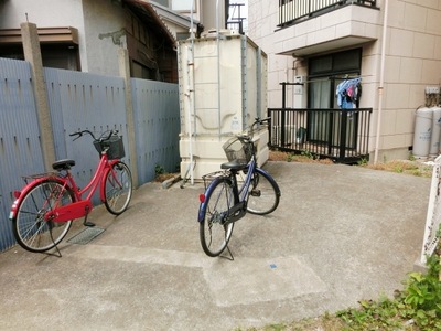 Parking lot. There is wide bicycle parking space