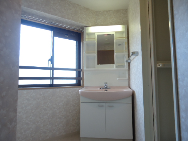 Washroom. It is light and airy because there is a window!