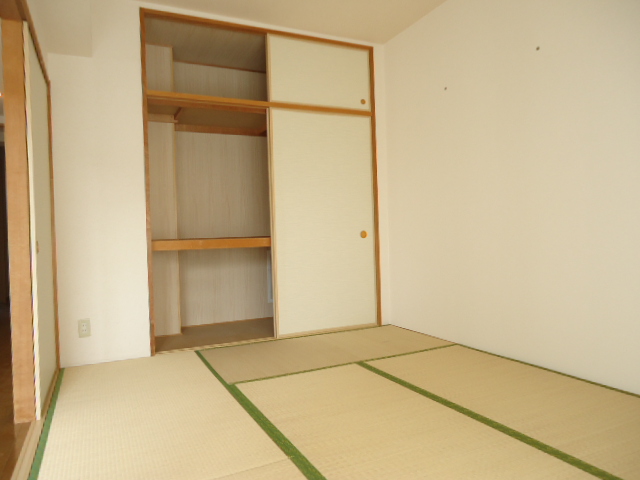 Living and room. It is a closet of with upper closet with depth