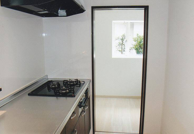 Kitchen. Next to the kitchen is a utility room