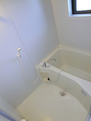 Bath. Loose put bathroom with a window