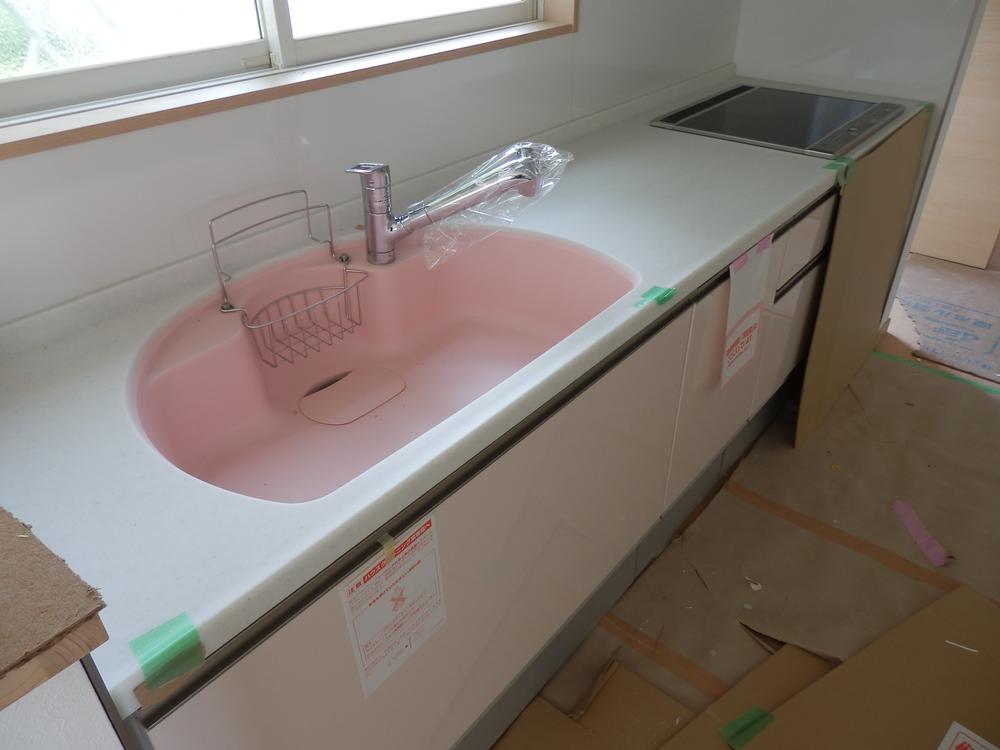 Kitchen. Peach pink cute kitchen sink