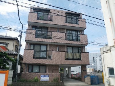 Building appearance. Balcony before is a parking lot