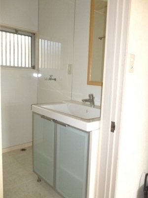 Washroom. It is bright and there is a wash basin space windows storage is substantial