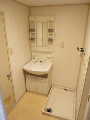 Washroom. There is also a washing machine inside the room.