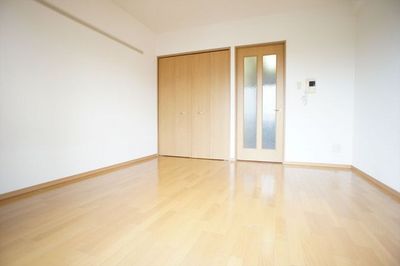 Living and room. Bright and warm tones of the flooring.