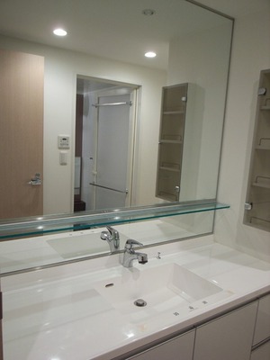 Washroom. Stylish finish large washbasin mirror tones and white