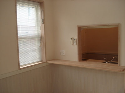 Living and room. Overlooking the kitchen with a counter from the living room.