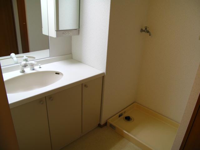 Wash basin, toilet. The wash basin on the right You can put even things, Room there is a wash basin. Laundry Area is also there in the room.