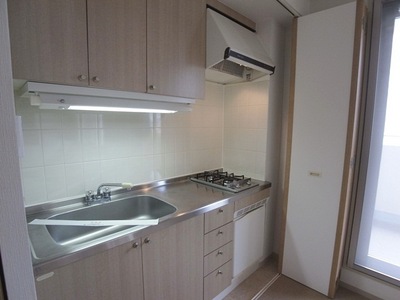 Kitchen. Typical indoor photo. I'm glad refrigerator and kitchen with two-burner stove