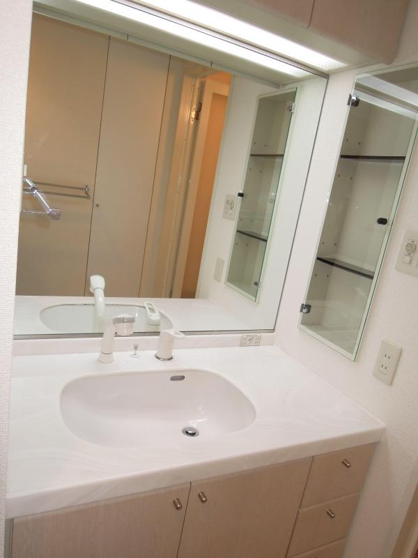 Washroom. With shampoo dresser, Wash basin of a large mirror. 