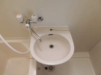 Washroom. With a convenient wash basin
