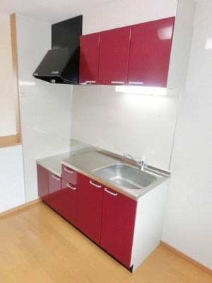 Kitchen. It is a cute color kitchen.