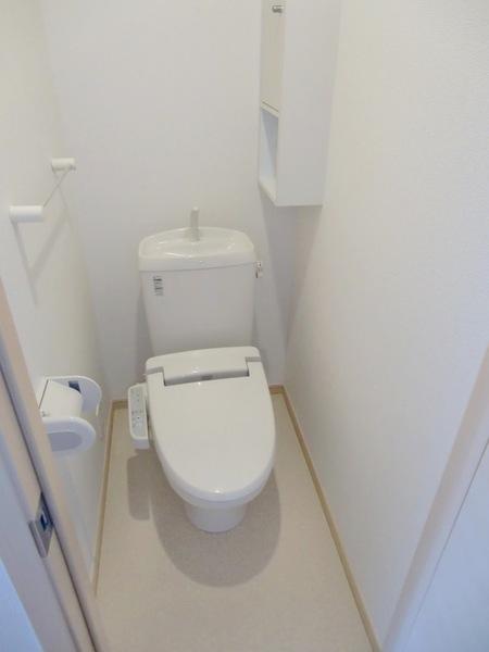 Toilet. Convenient shelf equipped. It is a warm water washing toilet seat.