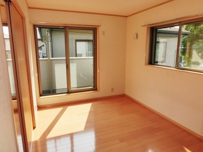 Living and room. It is a bright room with two-sided lighting.
