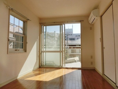 Living and room. It is a sunny apartment.