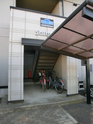Entrance. Bicycle shed