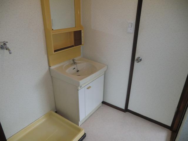 Washroom. Is a dressing room to independently wash basin there is also a washing machine inside the room