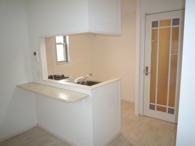 Kitchen. Overlooks the living room because the face-to-face kitchen