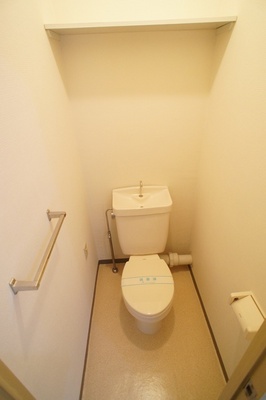 Toilet. Toilet (comes with a shelf on top) By the way, also has a outlet