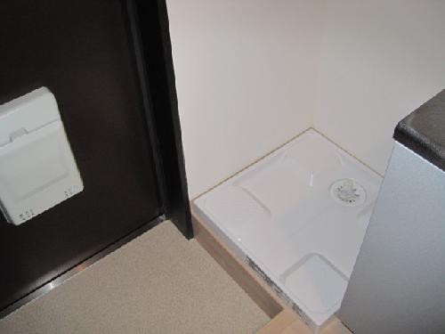 Washroom. Laundry Area is located in the room.