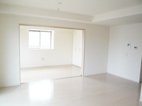 Living and room. It is a bright room with white floor