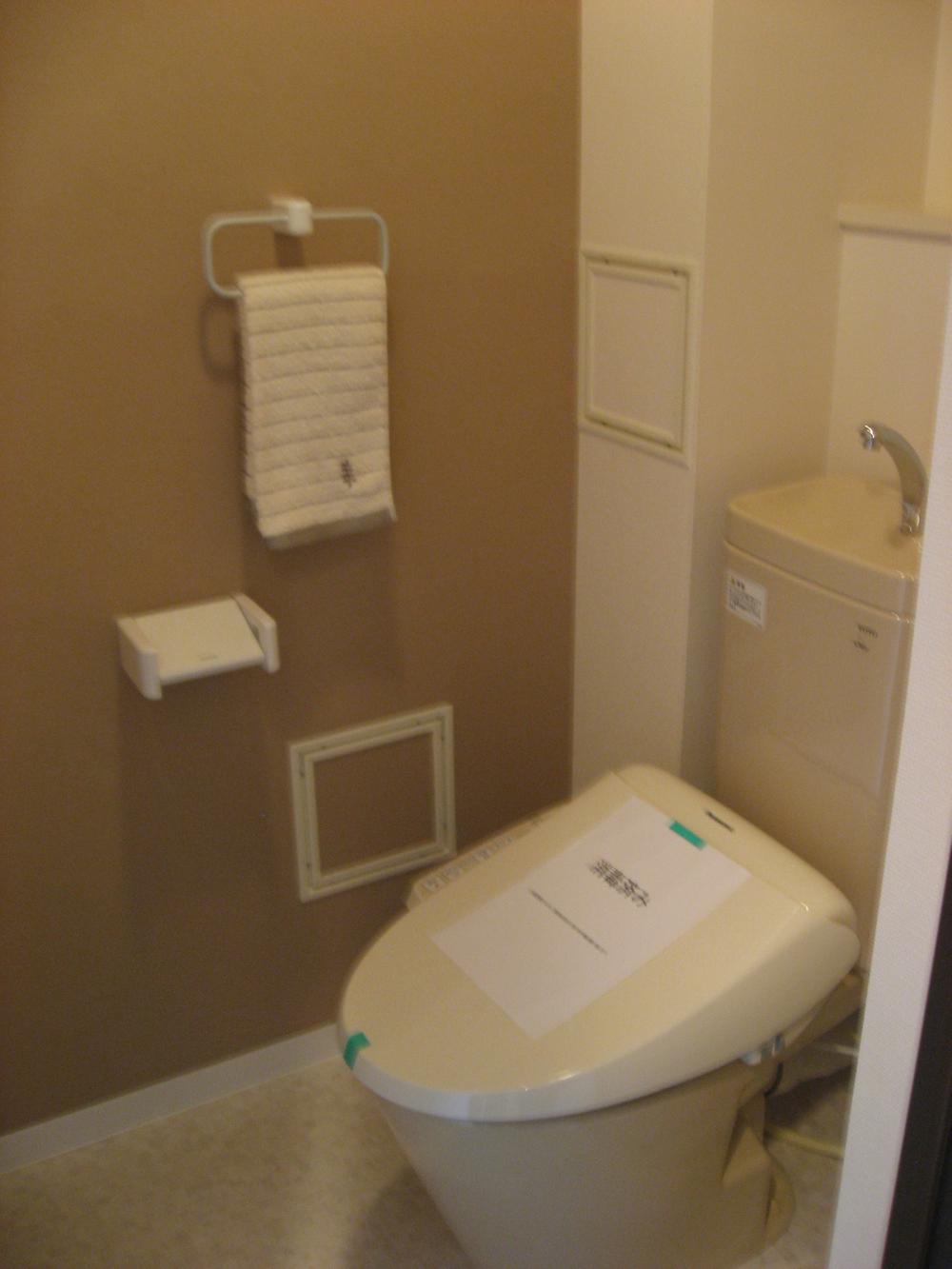 Toilet. New hot-water cleaning toilet seat. I water around is happy that's new.