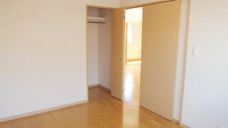 Living and room. There is storage of closet type