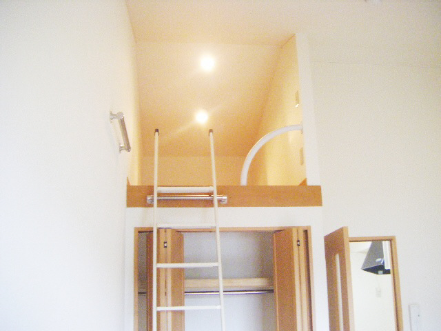 Living and room. Is a loft with rooms