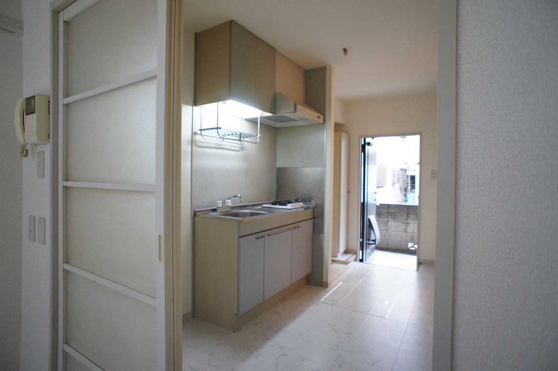 Kitchen. There is storage shelves in the kitchen up and down